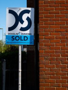 An estate agents sold sign